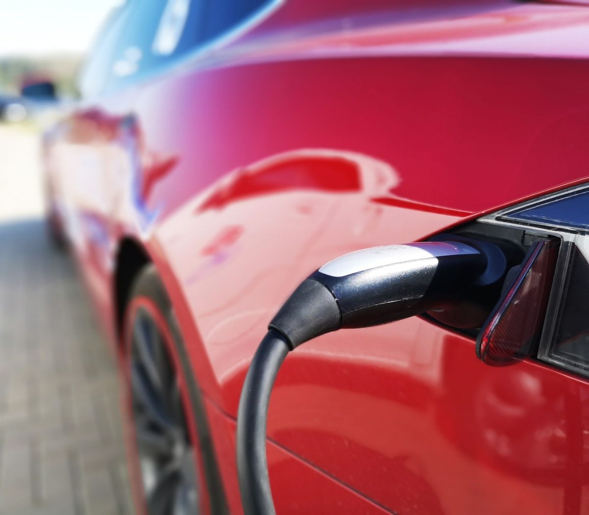 Car Being Charged with Charger After Electrical Vehicle Charging Installation in Sunrise