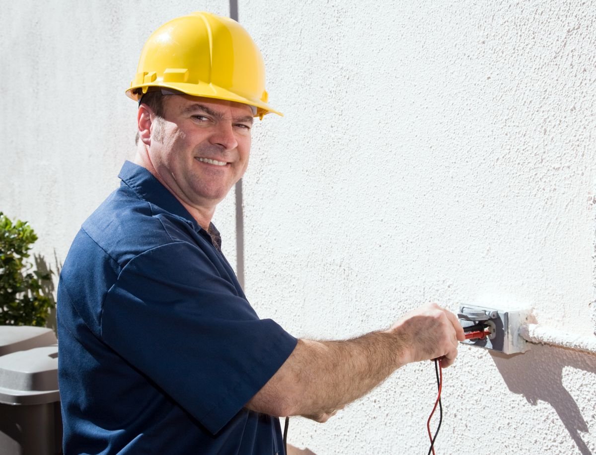 Residential Remodel Electrician working on outdoor outlet in Weston