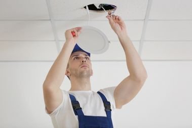 Licensed Electrician installing a light for Electrical Repairs in Davie, FL 