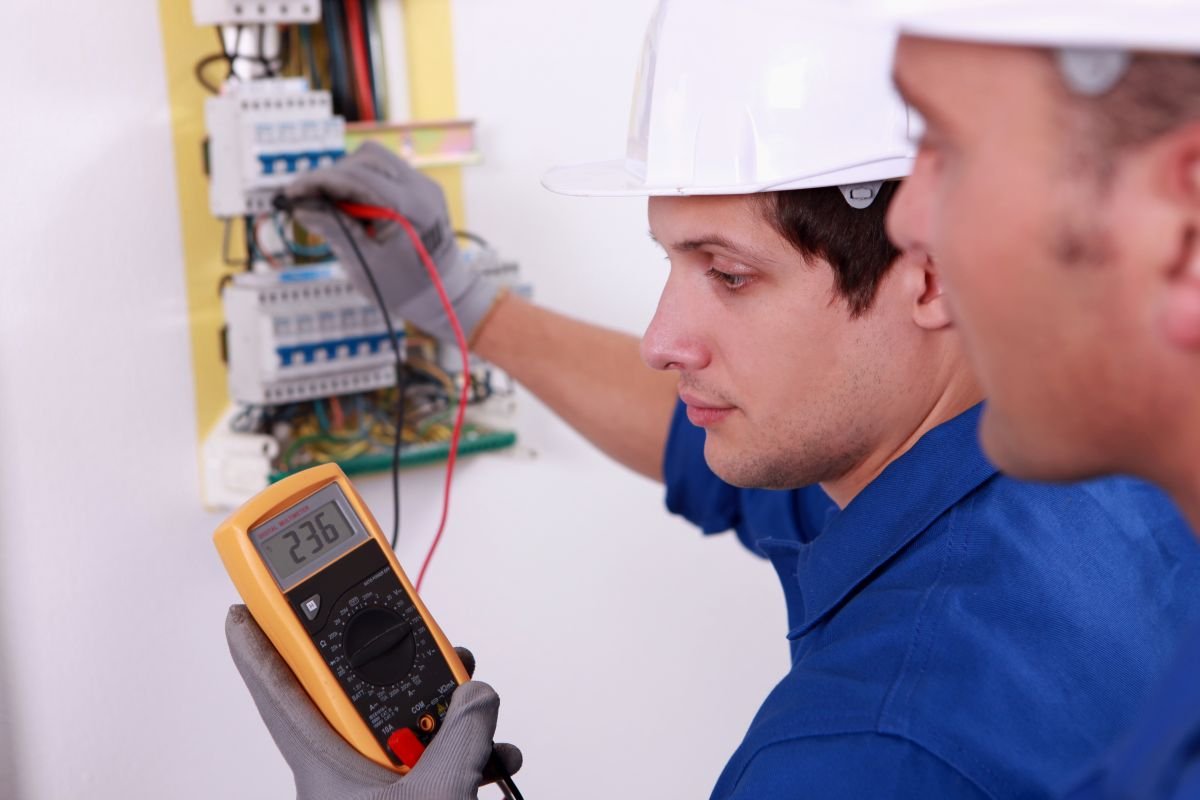 Electricians inspecting breaker box for Electrical Service in Pembroke Pines, FL