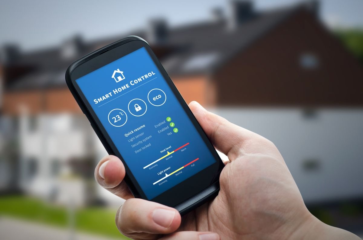 Hand Holding Cellphone with Smart Home Installation Services in Southwest Ranches