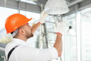 Electrician Performing Commercial Lighting Repair in Plantation