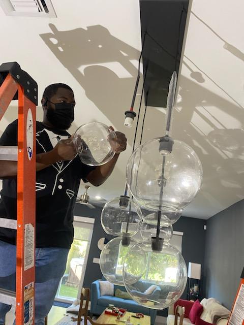 Electricians Installing Light Fixtures for Electrical Renovations for Kitchens in Fort Lauderdale