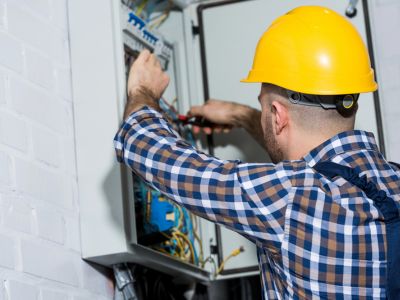An Electrician in Coral Springs, FL Performing an Electrical Panel Repair